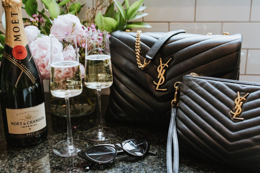 Elegant display of Moët champagne and YSL bags, perfect for luxurious occasions.